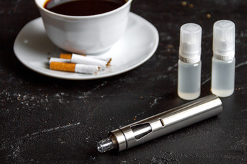 elimination of tobacco smoking electronic cigarette on dark background