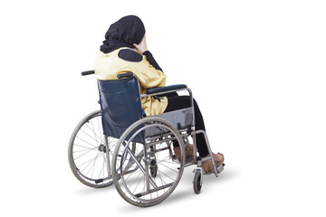 Disabled woman looks sad with a wheelchair