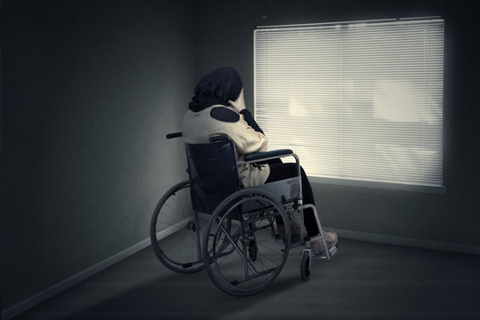 Disabled woman expressing depressed at home