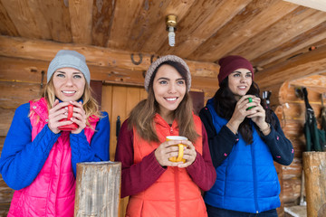 Young Girl Group On Terrace Holding Cup Hot Coffee Tea Wooden Country House Winter Resort Cottage Vacation