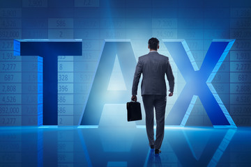 Businessman in high taxes concept