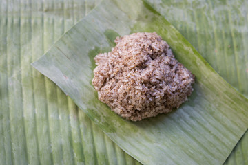 Thai style Sticky rice on banana leaf