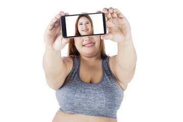 Woman takes selfie with smartphone