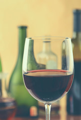 Glass of red wine and the bottle