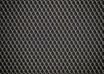 Plastic grille. Grid of audio amplifier background.