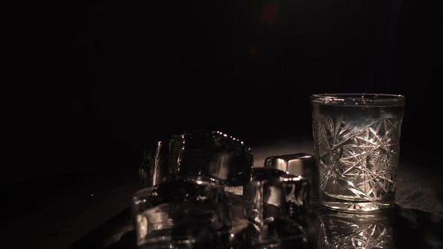 Burning ice and a glass of sambuka, streams of smoke