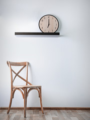 Simple interior with stool and decorations on white wall background