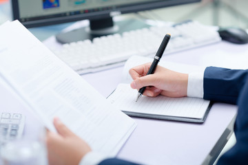 Businesswoman working at desk in office.