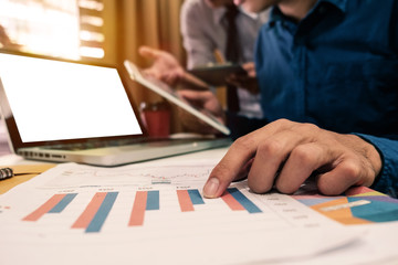 Business team meeting present.professional investor working with new startup project. Finance managers task.Digital tablet laptop computer design smart phone in morning light