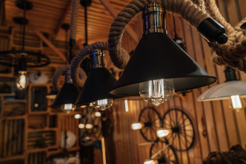 Fototapeta na wymiar Modern fashion lamp Edison interior loft room. Lantern with filament.