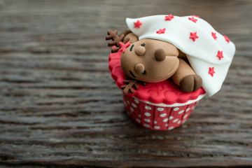 christmas theme cup cake on wooden background