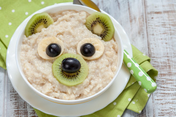 Kids breakfast porridge with fruits and nuts