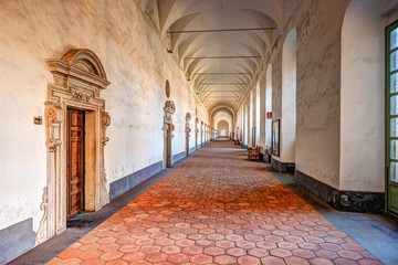 Image of the cloister arches inside a monastery. Architectural background.