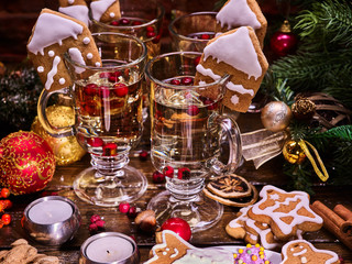 Christmas mulled wine with Christmas cookies. Christmas balls and candles.