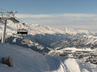 Skilift against background of landscape of the Caucasus Mountains on sunny winter day, Tetnuldi, region Svaneti in Georgia.