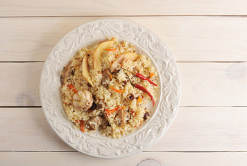 plate of pilaf with quince, garlic and chilli pepper