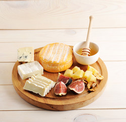 cheese plate - various types of cheese, honey and figs