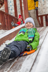 Winter portrait of kid boy in colorful clothes