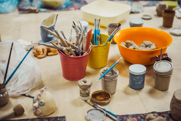 detail from pottery work room - brushes and tools