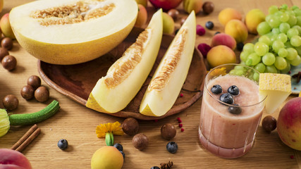 Fresh melon juice on table with Fruits