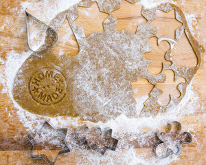 Dough homemade gingerbread on a wooden pastry board. Christmas homemade pastries.
