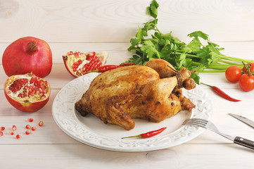 whole roasted chicken with bound feet in a bowl of hot chilli pe