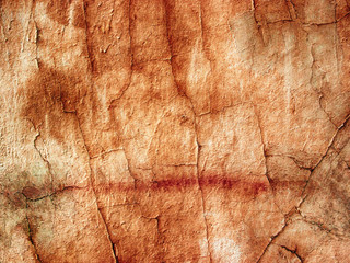 ragged wall of an abandoned delivered. yellow and orange shades.