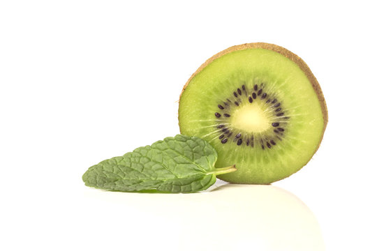 one piece of the cut sweet ripe kiwi with mint leaves