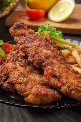 Fried fish in crispy batter with chips