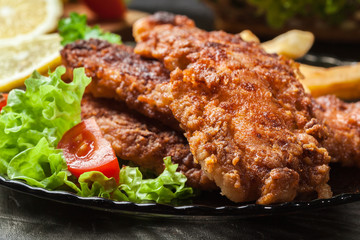 Fried fish in crispy batter with chips