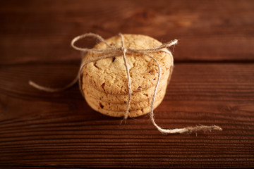 Homemade Chocolate cookies on wooden table. Pile of delicious chip cookies. Christmas cookies. Biscuits. Oat biscuits. Cereal biscuits with the addition of sesame, peanuts, sunflower and amaranth.