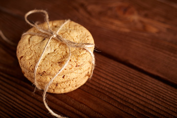 Homemade Chocolate cookies on wooden table. Pile of delicious chip cookies. Christmas cookies. Biscuits. Oat biscuits. Cereal biscuits with the addition of sesame, peanuts, sunflower and amaranth.