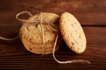 Homemade Chocolate cookies on wooden table. Pile of delicious chip cookies. Christmas cookies. Biscuits. Oat biscuits. Cereal biscuits with the addition of sesame, peanuts, sunflower and amaranth.