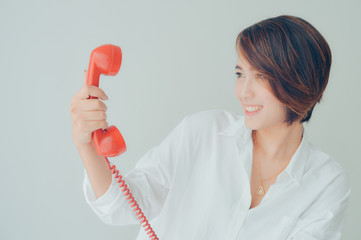 Asian girl with vintage telephone