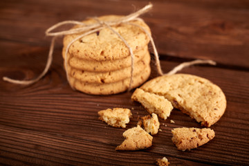 Homemade Chocolate cookies on wooden table. Pile of delicious chip cookies. Christmas cookies. Biscuits. Oat biscuits. Cereal biscuits with the addition of sesame, peanuts, sunflower and amaranth.