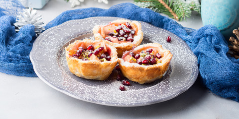 Christmas mini apple pies with pomegranate seeds. Banner