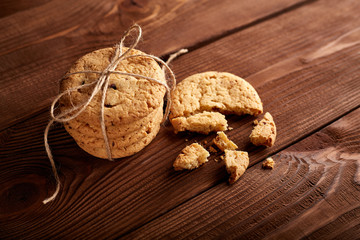 Homemade Chocolate cookies on wooden table. Pile of delicious chip cookies. Christmas cookies. Biscuits. Oat biscuits. Cereal biscuits with the addition of sesame, peanuts, sunflower and amaranth.