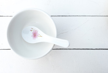 
Top view of Empty bowl with spoon on wooden table background