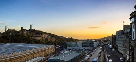Edinburgh cityscape and skyline as seen from North Bridge during sunrise