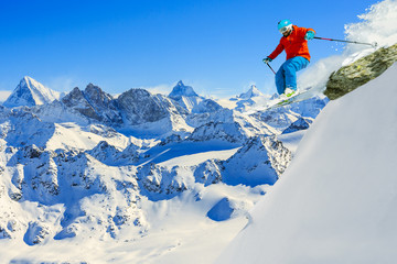 Naklejka na ściany i meble Skiing with amazing view of swiss famous mountains in beautiful