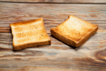 Toast on a rustic wooden background