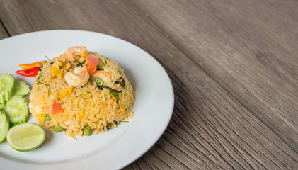 Shrimp fried rice on wood floor