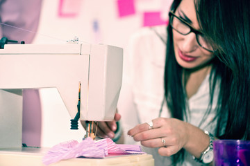 Design studio.  Woman with sewing machine