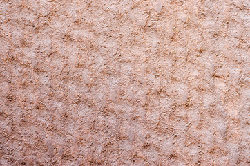 texture of brown cement background (selective focus at center)
