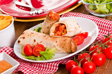 Tortilla wraps with chicken and vegetable. 