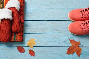 winter clothes and shoes on a wooden background