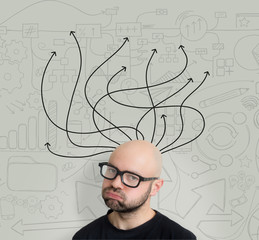 Arrows going out of the head of a bored attractive bold man geek