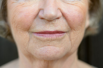 Closeup on the mouth of a senior woman