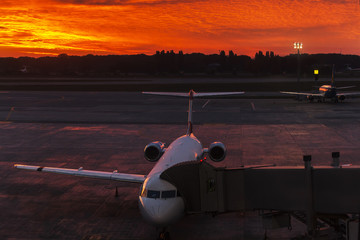 Plane at the airport during sunset