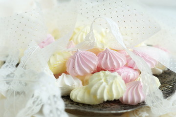 meringue cakes in vintage plate and lace